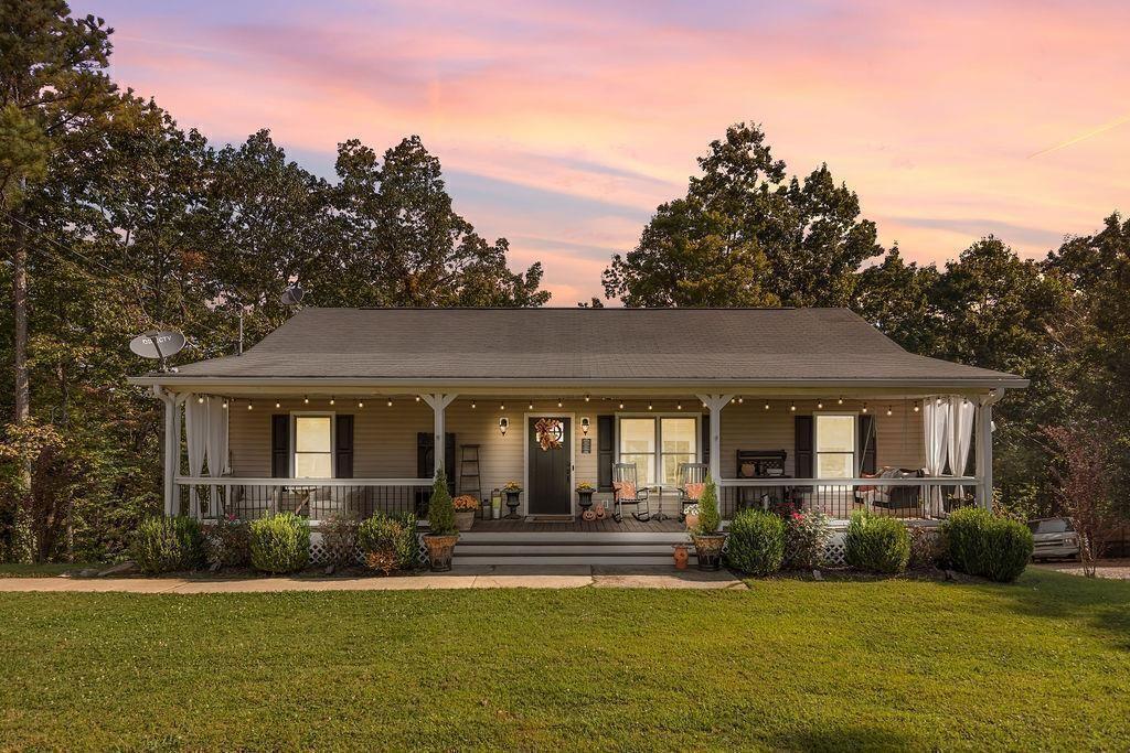 603 Cutoff Road Jasper, GA 30143 - Photo 24 of 24 a front view of a house with a yard garden and patio