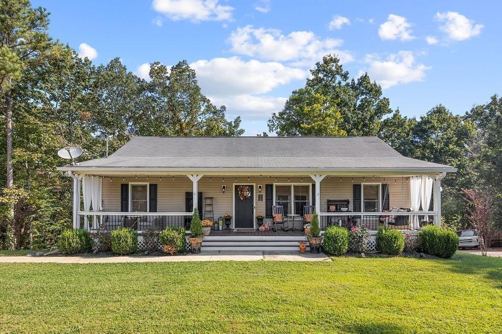 603 Cutoff Road Jasper, GA 30143 - Photo 3 of 24 a view of house with a big yard and potted plants