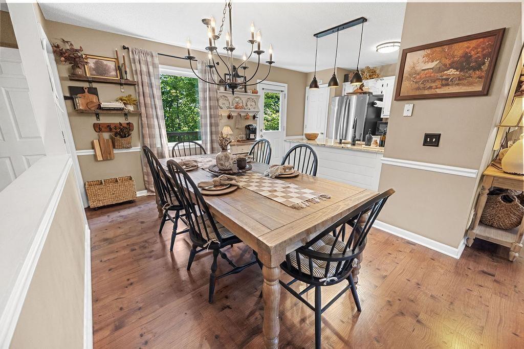 603 Cutoff Road Jasper, GA 30143 - Photo 10 of 24 a view of a dining room with furniture window and wooden floor