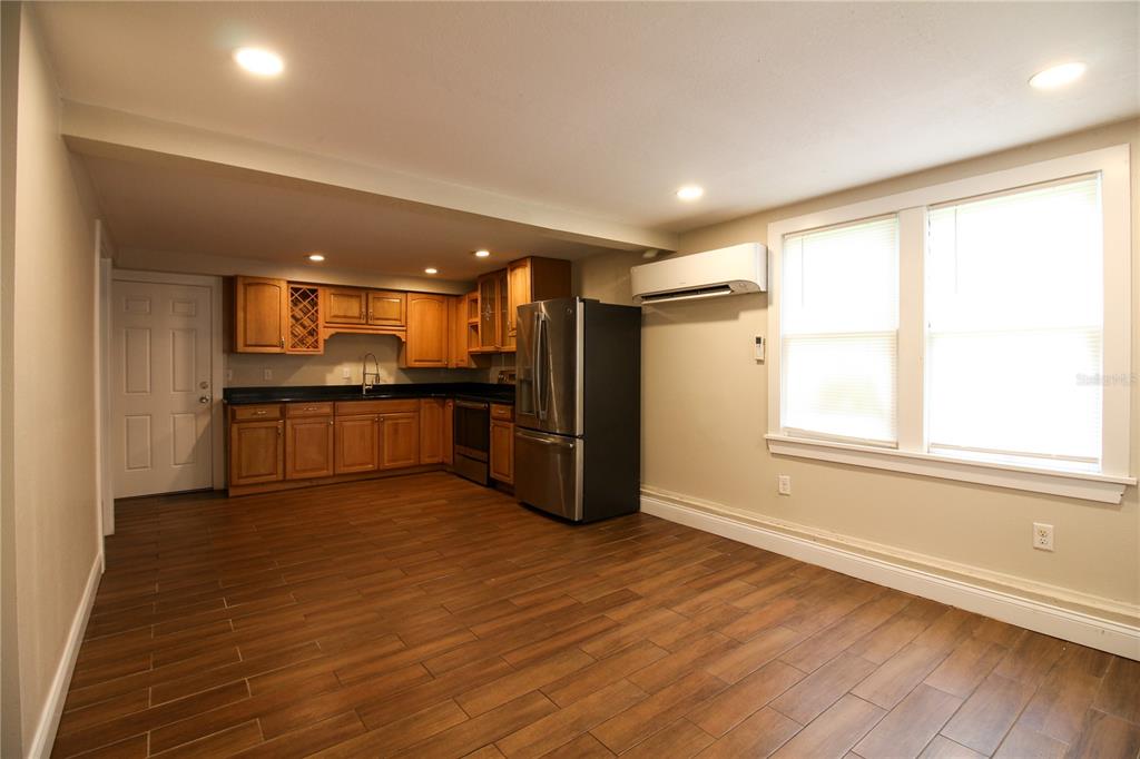 1123 South Tennessee Avenue Lakeland, FL 33803 - Photo 4 of 12 a view of kitchen with wooden floor and electronic appliances