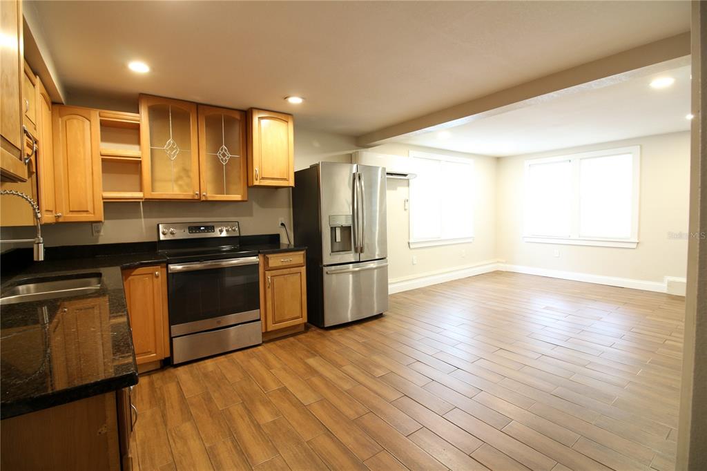 1123 South Tennessee Avenue Lakeland, FL 33803 - Photo 6 of 12 a kitchen with stainless steel appliances a refrigerator and a sink