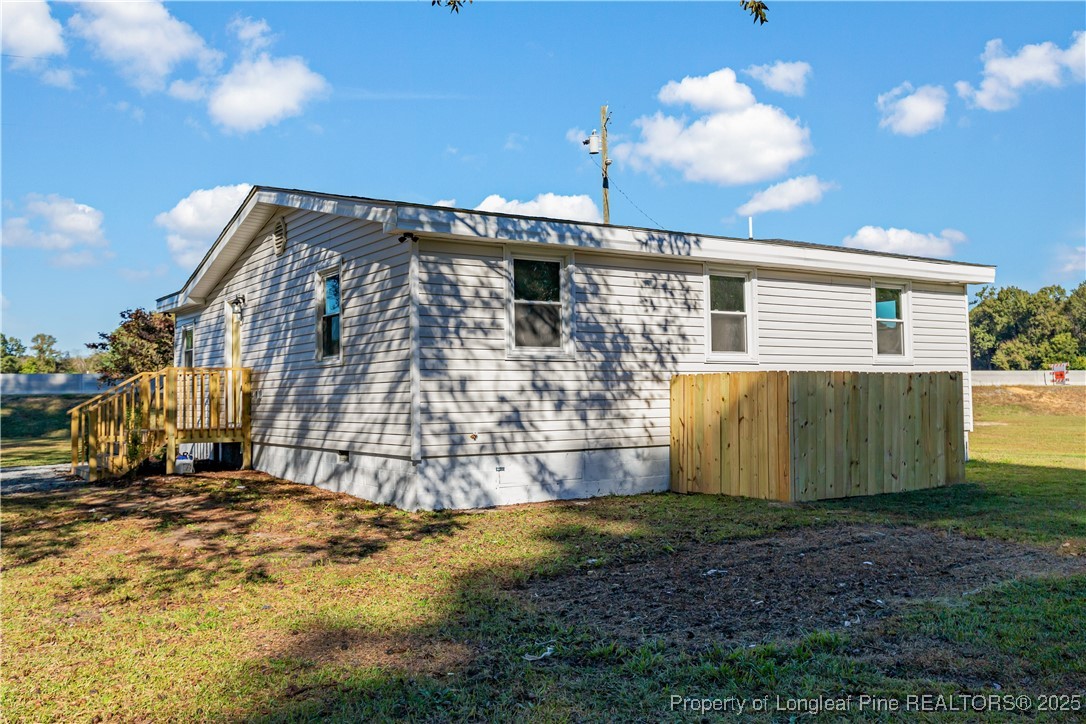 1340 George Perry Lee Road Dunn, NC 28334 - Photo 6 of 31 a view of a house with backyard