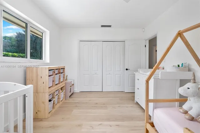 a view of an entryway with wooden floor