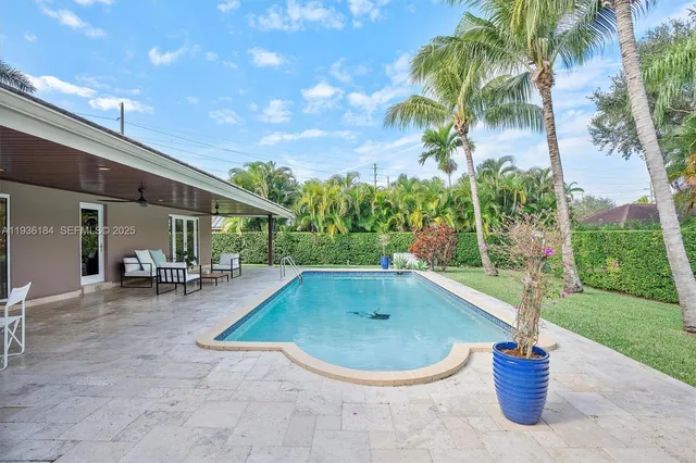 a view of a swimming pool with a patio