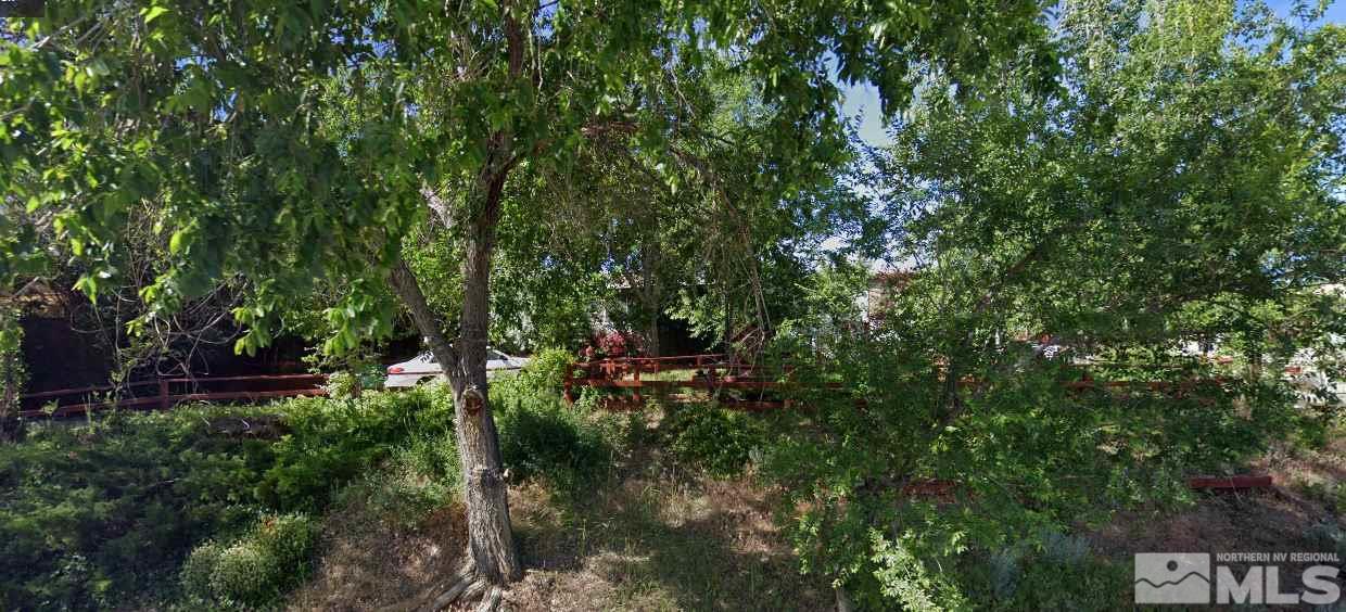 1600 Collins Circle Reno, NV 89506 - Photo 1 of 1 a view of a street with a tree