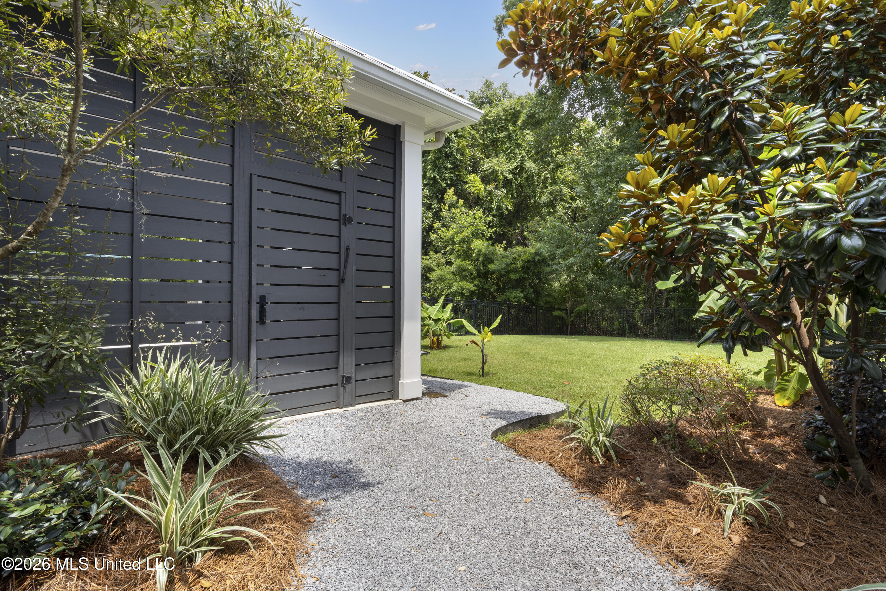 305 Beach Hill Road Ocean Springs, MS 39564 - Photo 50 of 63 Walk-way to Carport