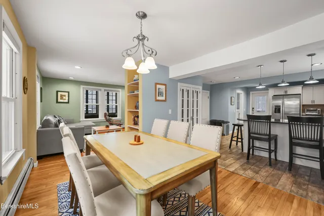 a view of a dining room with furniture window and wooden floor