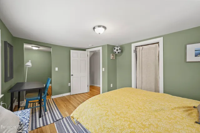 a bedroom with a bed and a view of bathroom