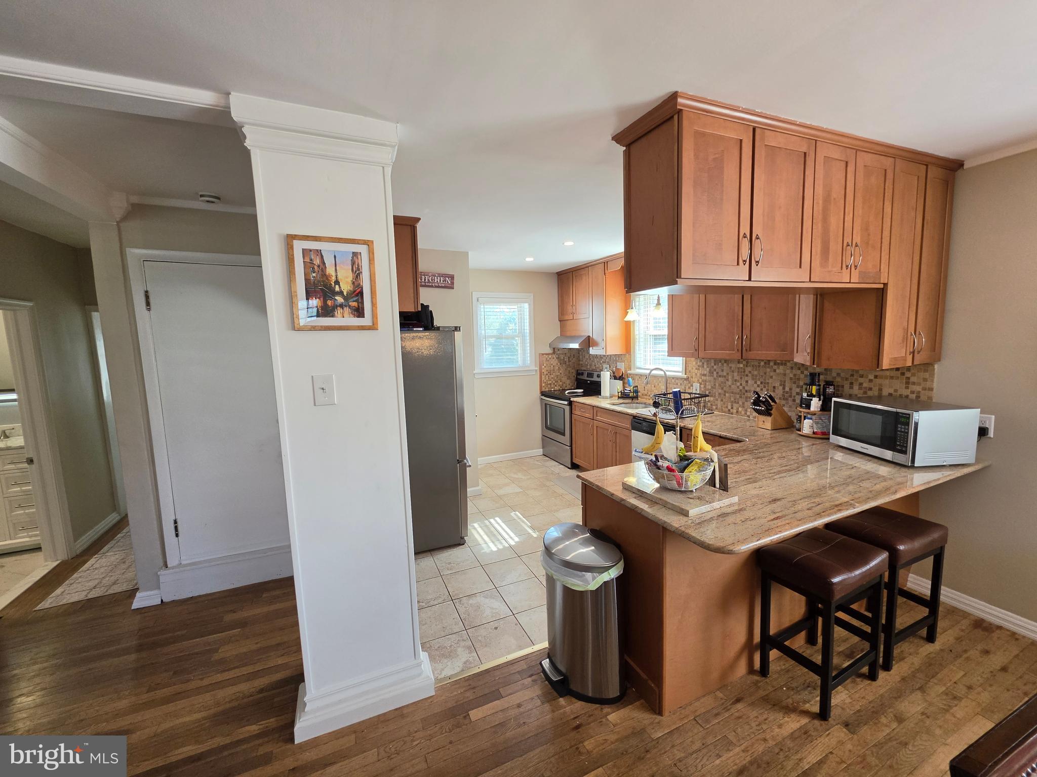 142 New Road Horsham, PA 19044 - Photo 7 of 38 a kitchen with stainless steel appliances a refrigerator and a stove top oven