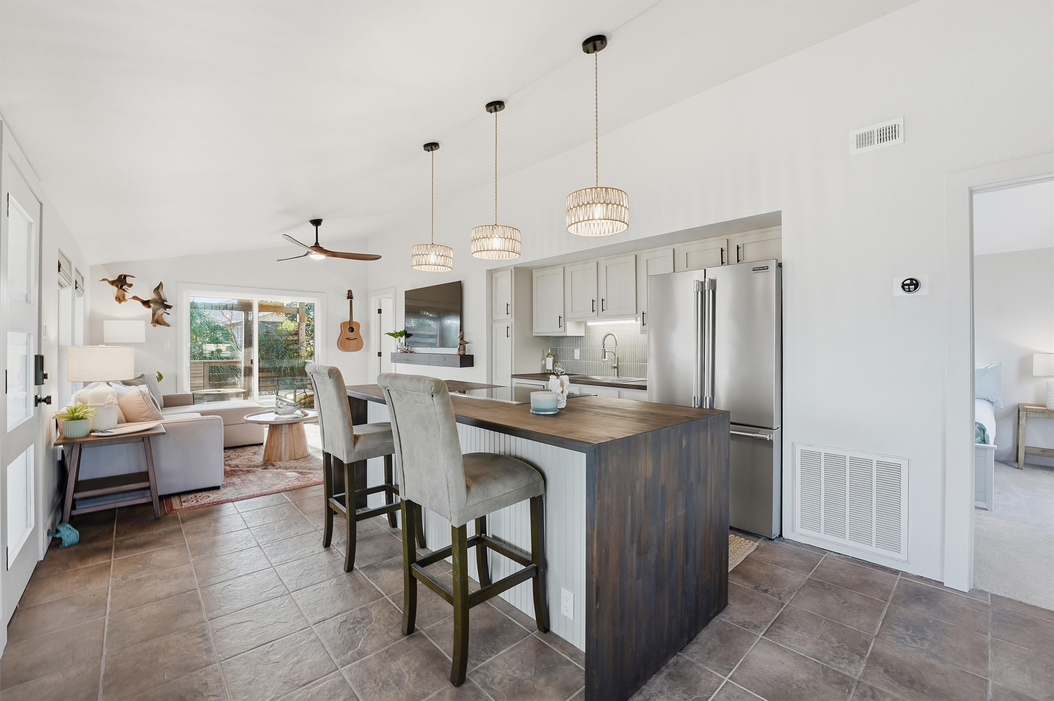 16530 Lewis Scot Road Jamaica Beach, TX 77554 - Photo 4 of 35 Beautiful custom waterfall butcher's block island. This space is perfect for entertaining.