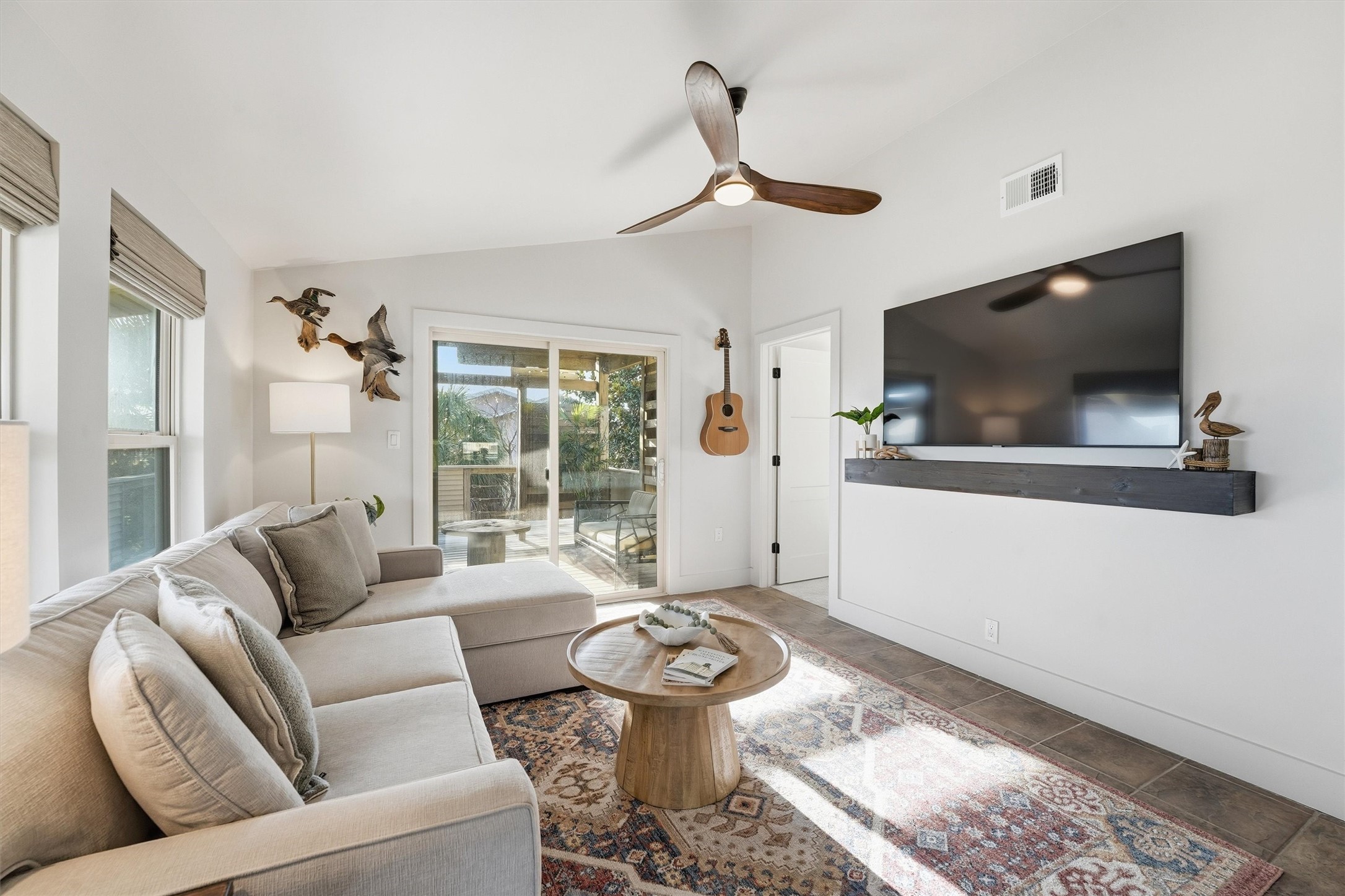 16530 Lewis Scot Road Jamaica Beach, TX 77554 - Photo 5 of 35 Cozy living room bathed in sunlight.
