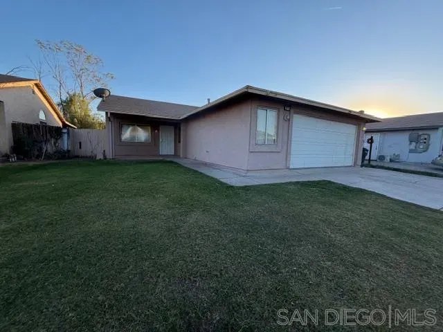 a house with garden in front of it