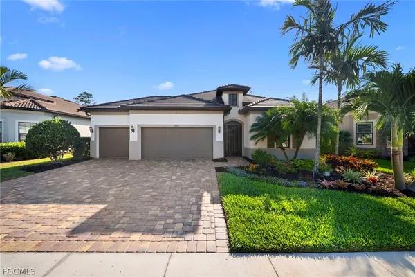 a view of a house with a yard and plants