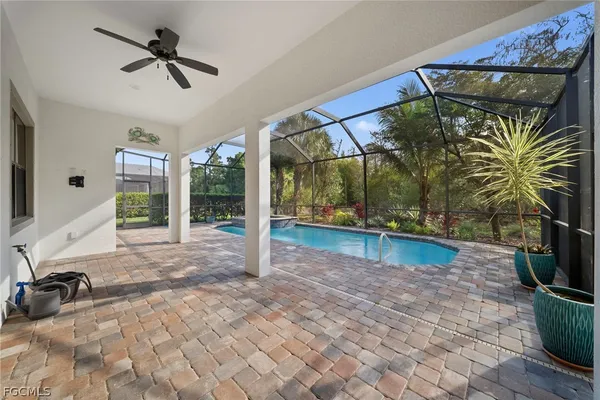 a view of swimming pool with seating space