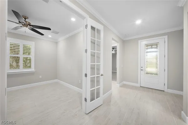 a view of an empty room with a window