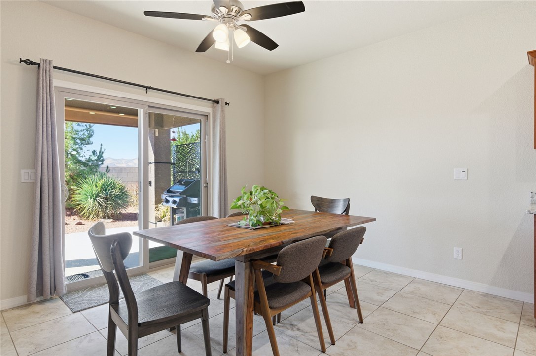 4745 East Old W Road Kingman, AZ 86401 - Photo 12 of 37 Dining room featuring baseboards and ceiling fan
