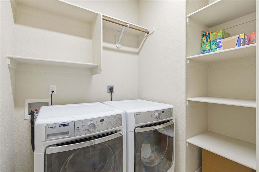 4745 East Old W Road Kingman, AZ 86401 - Photo 14 of 37 Laundry room with washer and dryer and a textured wall