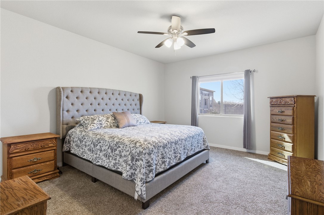 4745 East Old W Road Kingman, AZ 86401 - Photo 15 of 37 Carpeted bedroom with ceiling fan and baseboards