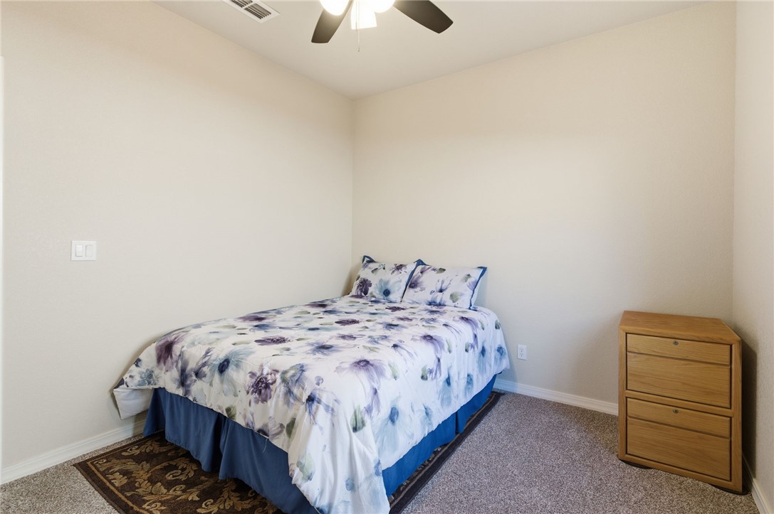 4745 East Old W Road Kingman, AZ 86401 - Photo 20 of 37 Carpeted bedroom featuring baseboards and ceiling fan