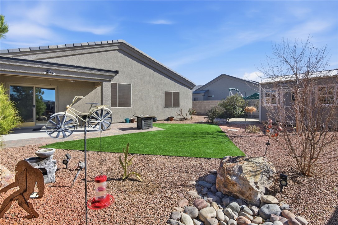 4745 East Old W Road Kingman, AZ 86401 - Photo 29 of 37 Back of house with a patio and stucco siding