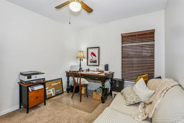 a view of a workspace with furniture