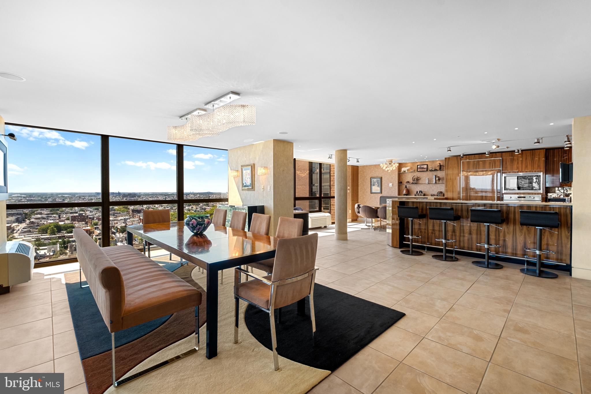 233 South 6th Street, Unit 2009 Philadelphia, PA 19106 - Photo 11 of 55 a living room with furniture a rug and a floor to ceiling window
