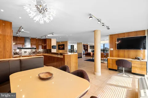 a kitchen with a table and chairs in it