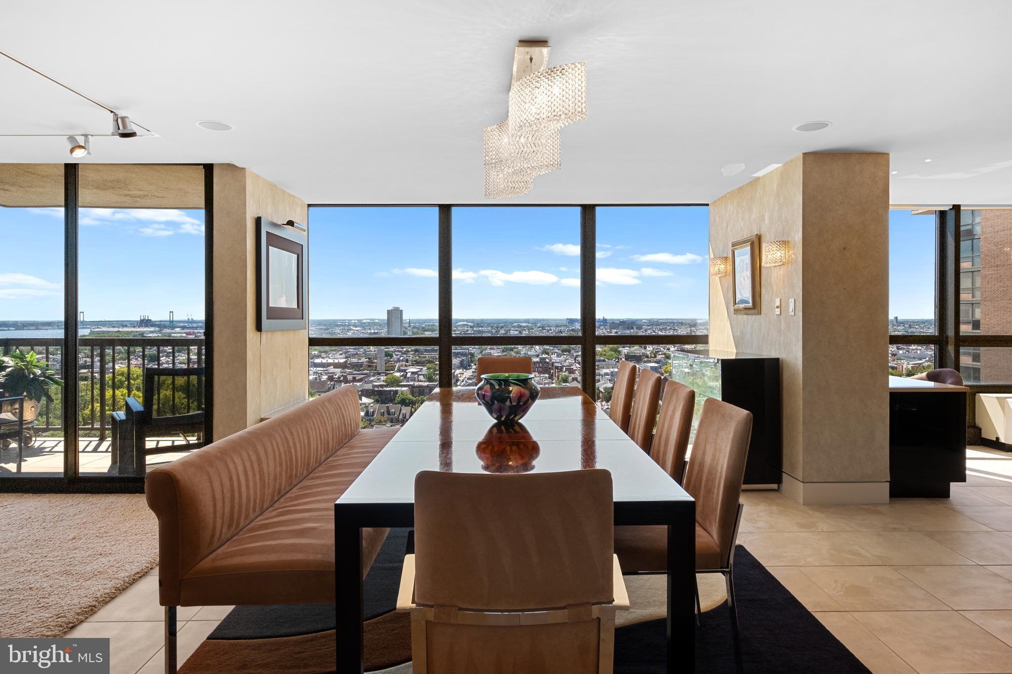 233 South 6th Street, Unit 2009 Philadelphia, PA 19106 - Photo 12 of 55 a dining room with furniture a chandelier and wooden floor