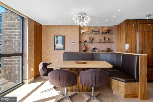 a view of a dining room with furniture and window