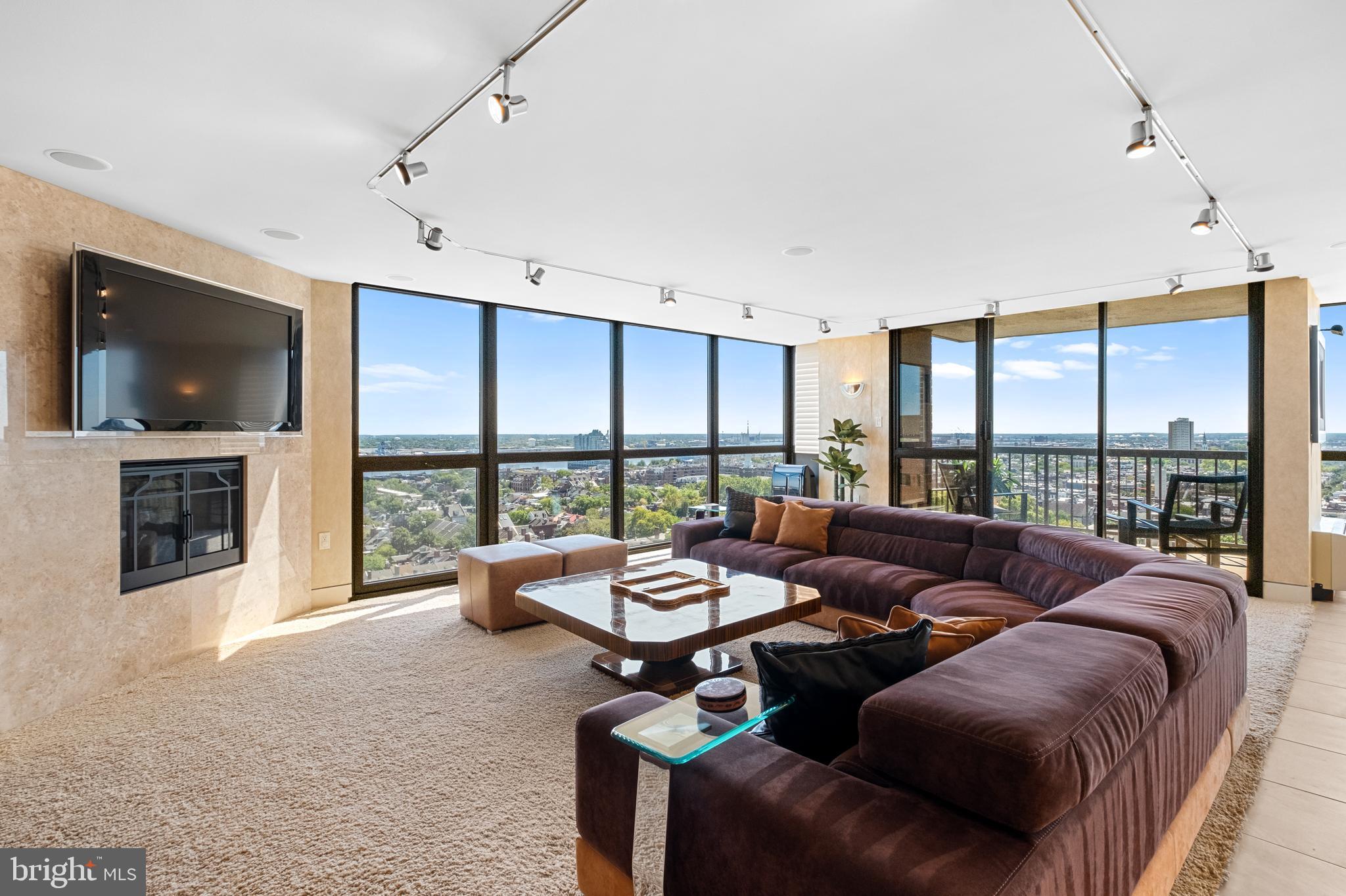 233 South 6th Street, Unit 2009 Philadelphia, PA 19106 - Photo 13 of 55 a living room with furniture and a large window