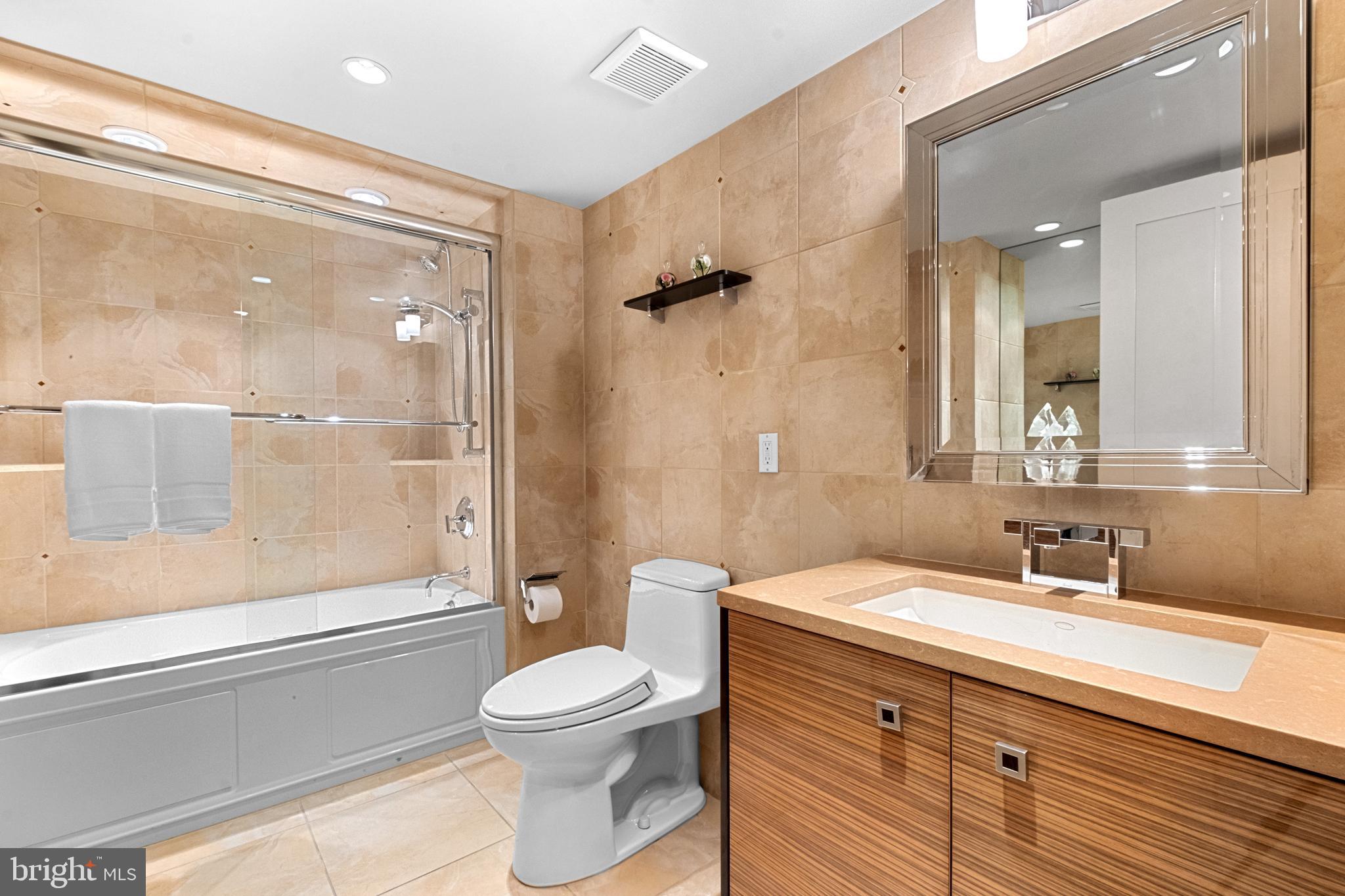 233 South 6th Street, Unit 2009 Philadelphia, PA 19106 - Photo 23 of 55 a bathroom with a sink a toilet and shower