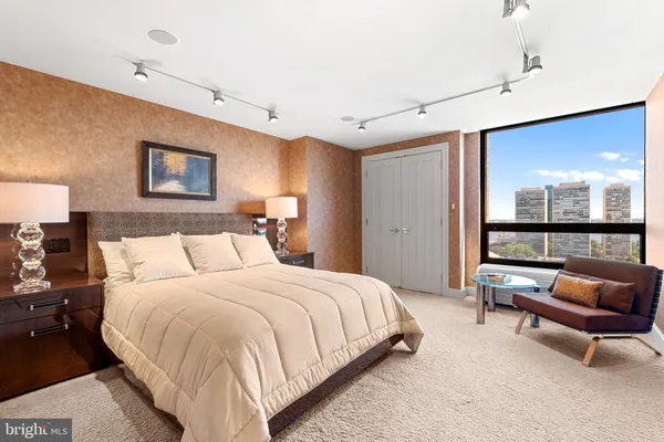a bedroom with a bed and a television