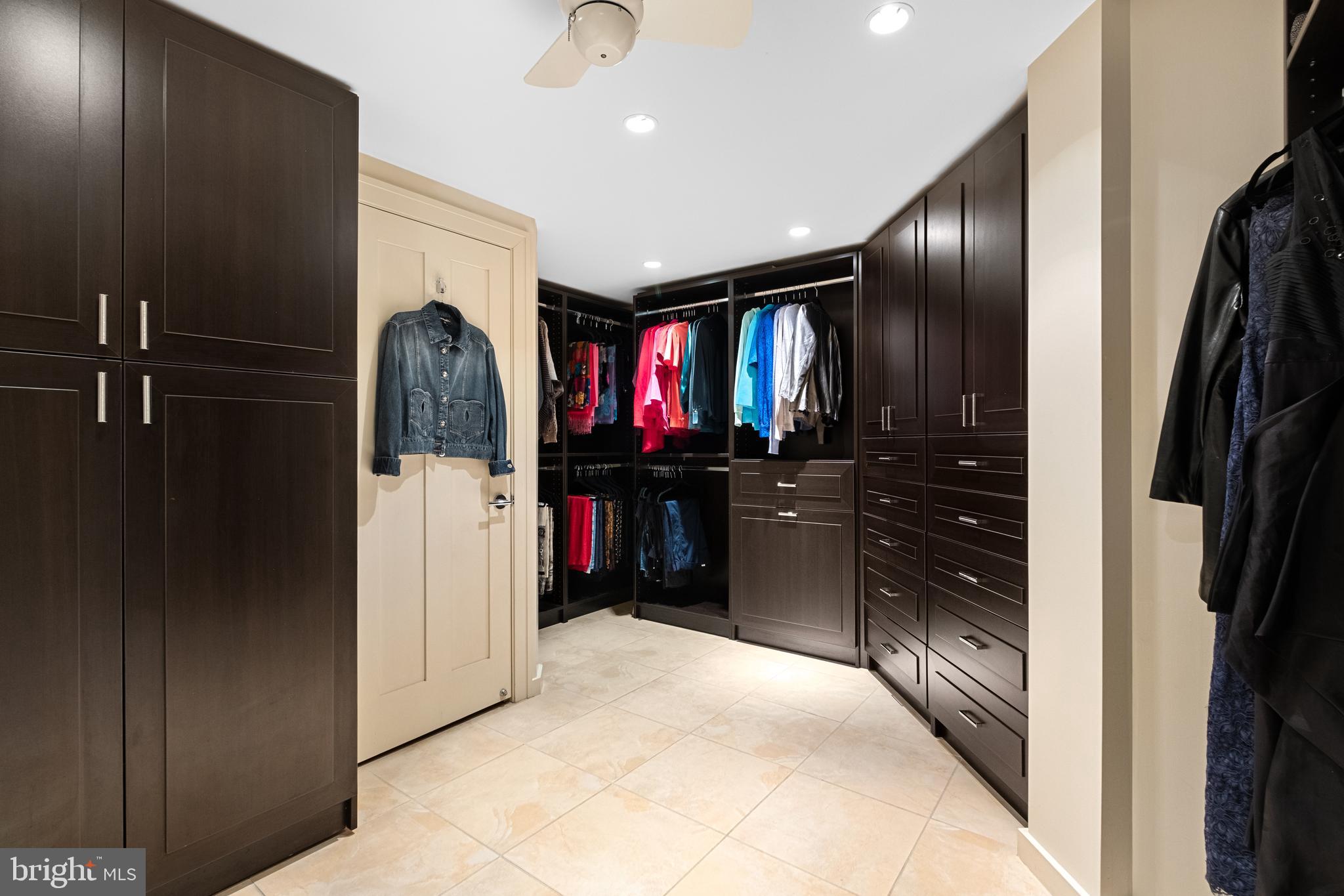 233 South 6th Street, Unit 2009 Philadelphia, PA 19106 - Photo 29 of 55 a kitchen with stainless steel appliances kitchen island granite countertop a refrigerator and a sink