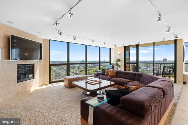 a living room with furniture and a large window