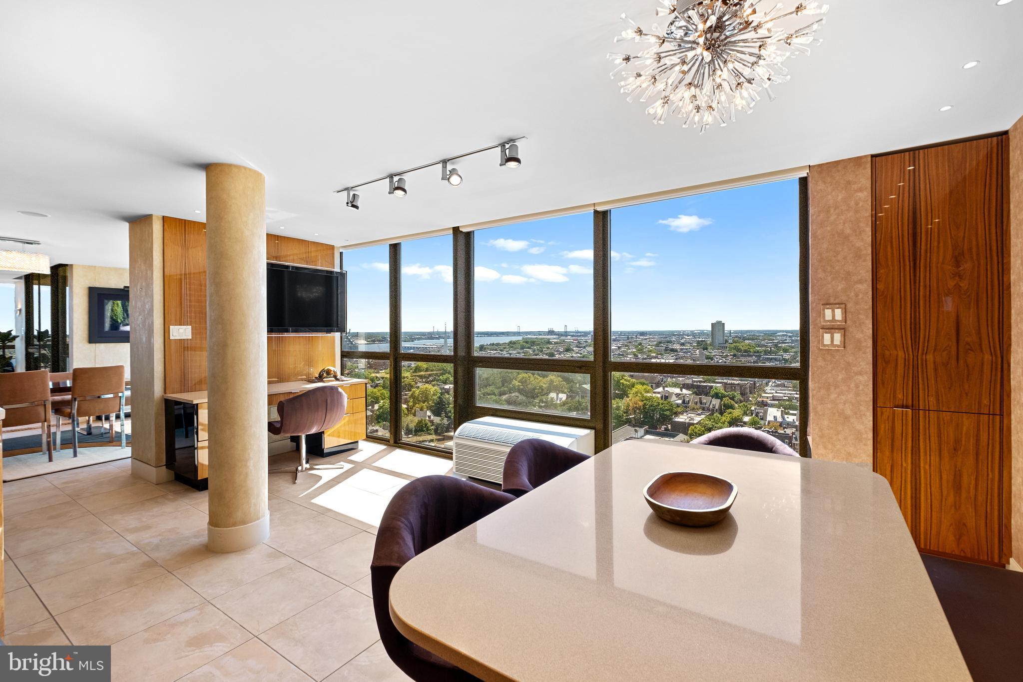 233 South 6th Street, Unit 2009 Philadelphia, PA 19106 - Photo 7 of 55 a dining room with furniture and a floor to ceiling window