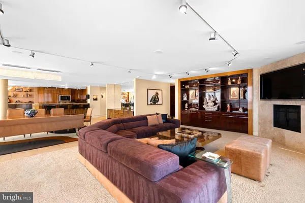 a living room with fireplace furniture and a flat screen tv