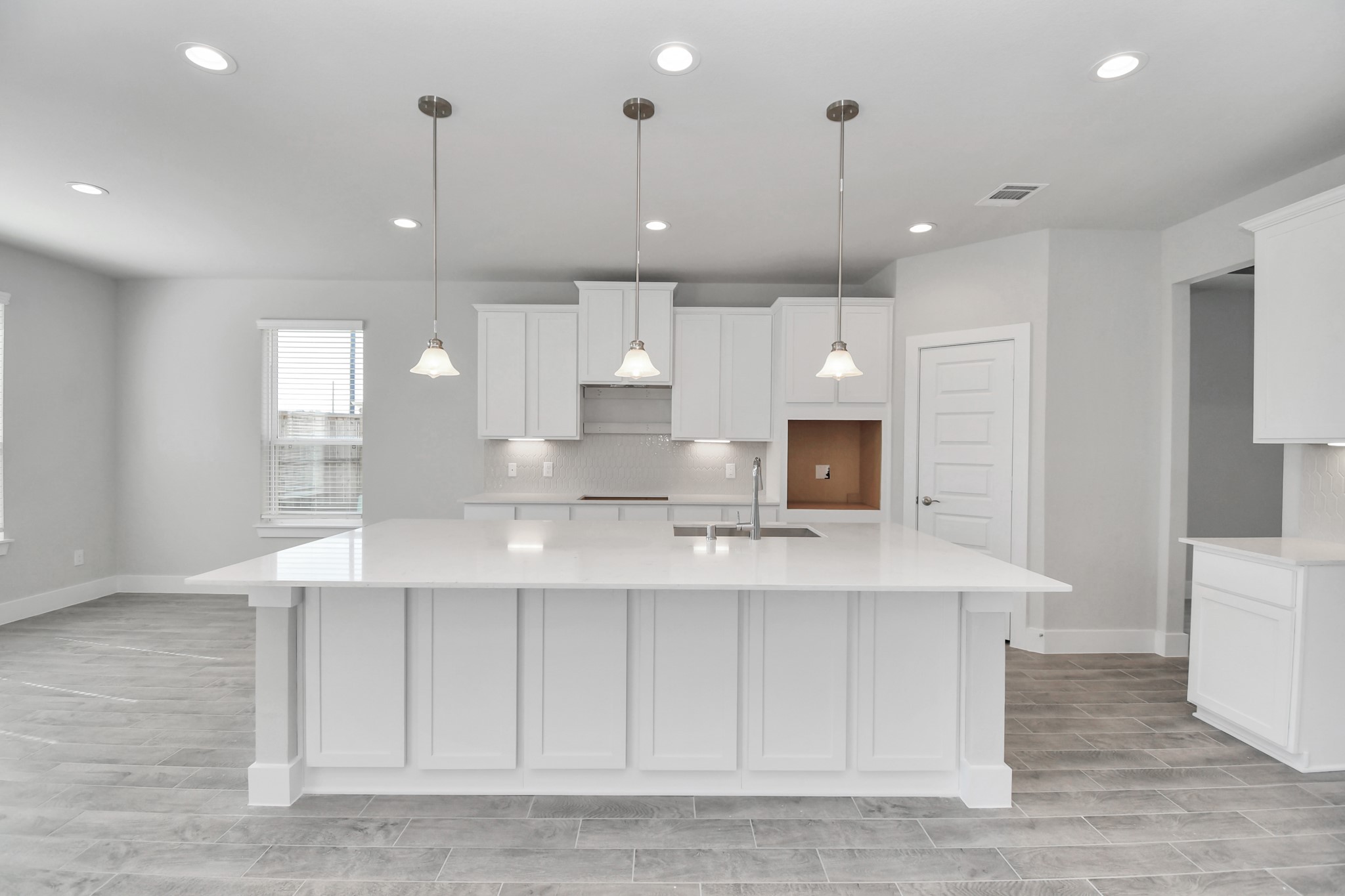3103 Native Spg Drive Spring, TX 77373 - Photo 8 of 36 a large kitchen with kitchen island a sink stainless steel appliances and cabinets