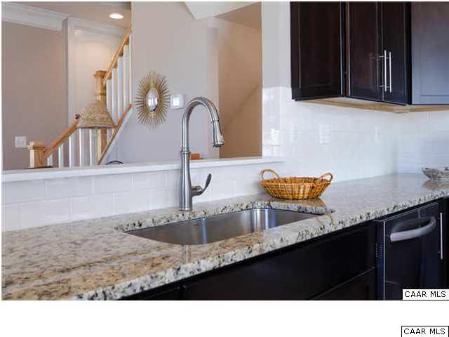 2120 Avinity Loop Charlottesville, VA 22902 - Photo 8 of 24 a kitchen with granite countertop a sink and cabinets