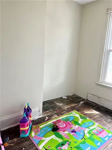 a room with toys and blue walls