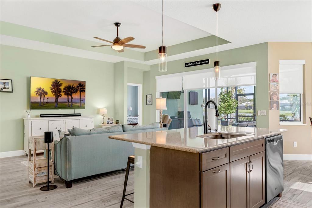 422 Good Life Way Daytona Beach, FL 32124 - Photo 12 of 79 a living room with furniture a flat screen tv and a large window