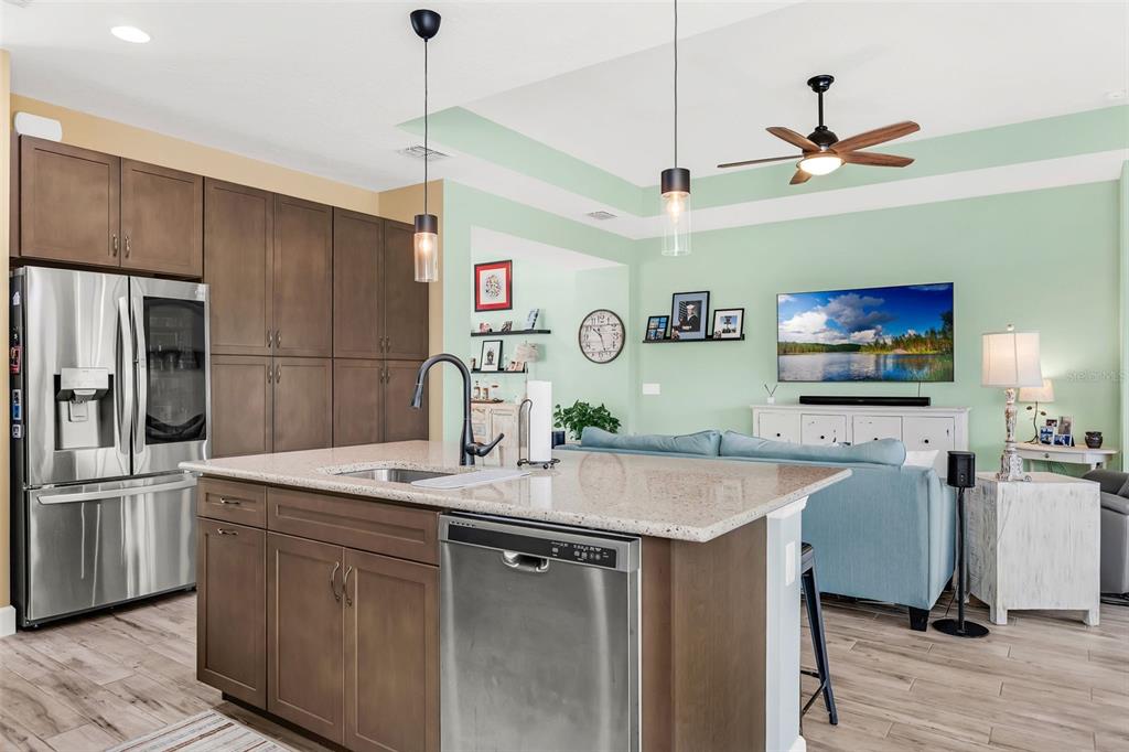 422 Good Life Way Daytona Beach, FL 32124 - Photo 14 of 79 a kitchen with stainless steel appliances granite countertop a sink a refrigerator and a stove