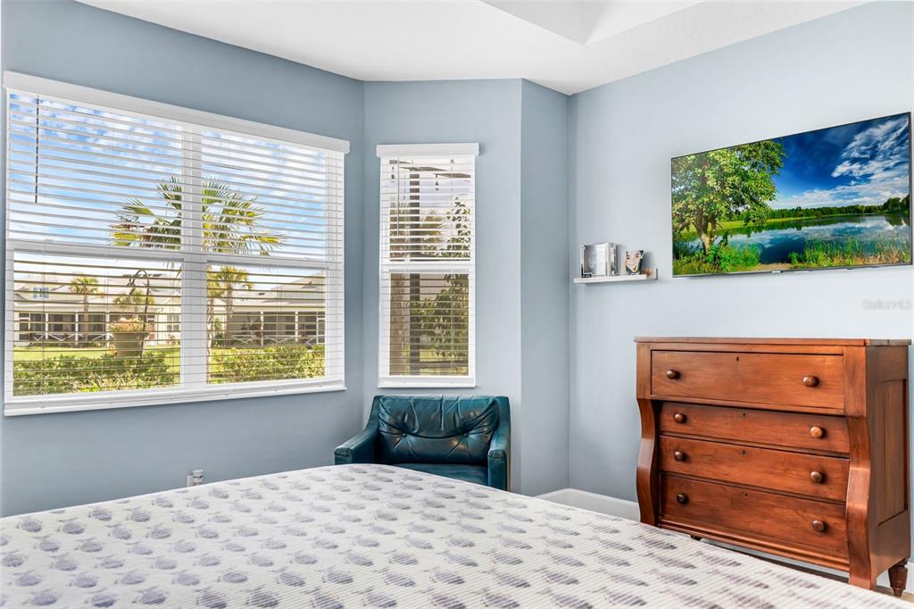 422 Good Life Way Daytona Beach, FL 32124 - Photo 17 of 64 a bedroom with a bed and a window with the chair