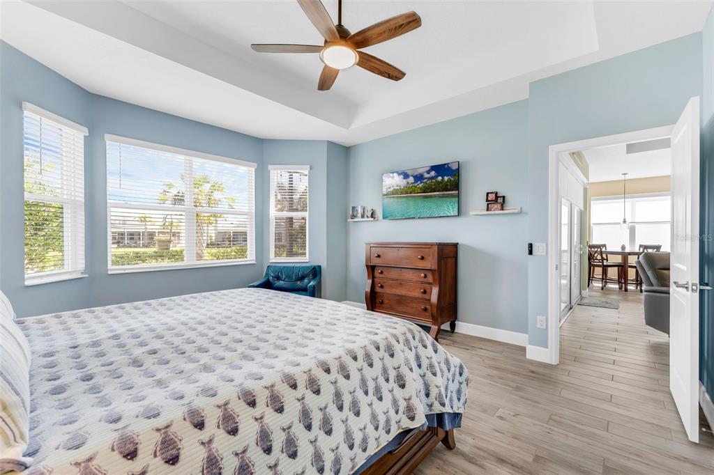 422 Good Life Way Daytona Beach, FL 32124 - Photo 20 of 79 a bedroom with a bed and dresser with wooden floor