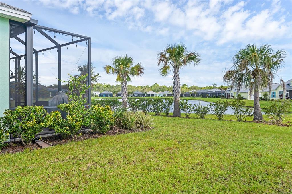 422 Good Life Way Daytona Beach, FL 32124 - Photo 26 of 79 a view of a garden with a building in the background