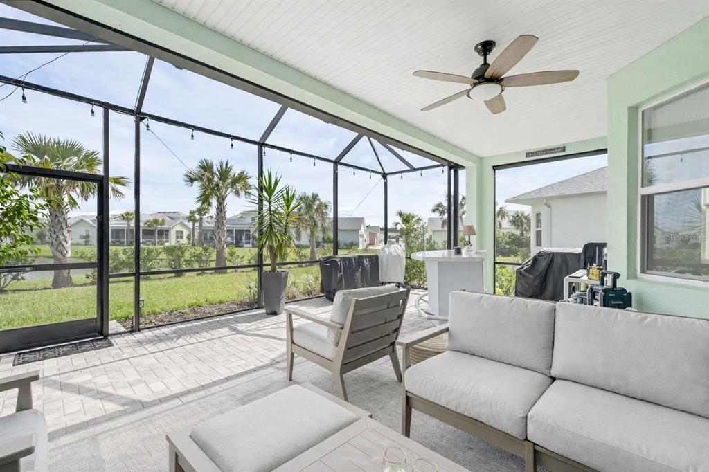 422 Good Life Way Daytona Beach, FL 32124 - Photo 3 of 64 a living room with couch and a floor to ceiling window