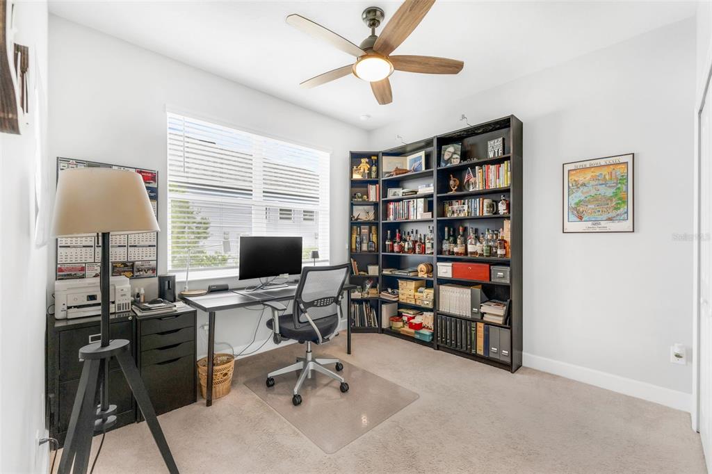 422 Good Life Way Daytona Beach, FL 32124 - Photo 38 of 79 a view of a workspace with a bookshelf