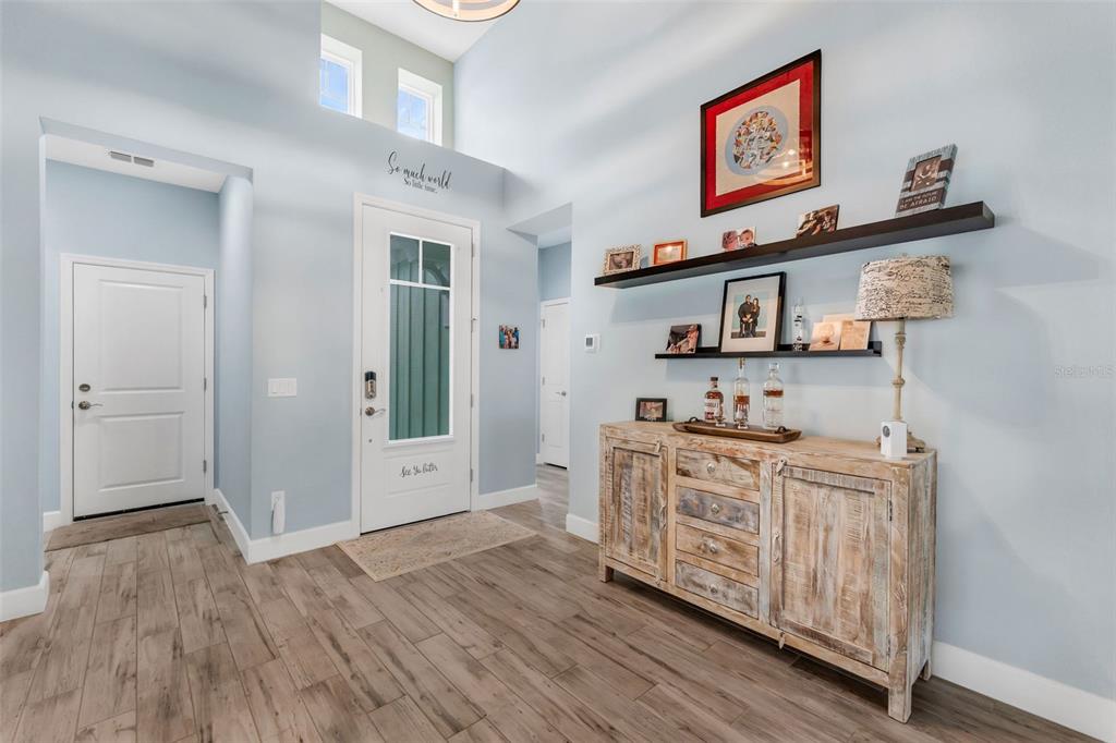 422 Good Life Way Daytona Beach, FL 32124 - Photo 5 of 79 a kitchen with stainless steel appliances granite countertop a stove and cabinets