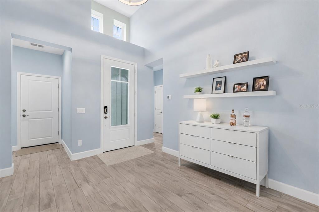 422 Good Life Way Daytona Beach, FL 32124 - Photo 6 of 64 a view of workspace and bedroom with wooden floor