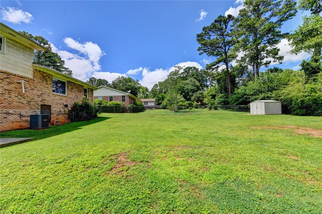 1577 Harbour Oaks Road Tucker, GA 30084 - Photo 54 of 58 a view of a house with a big yard