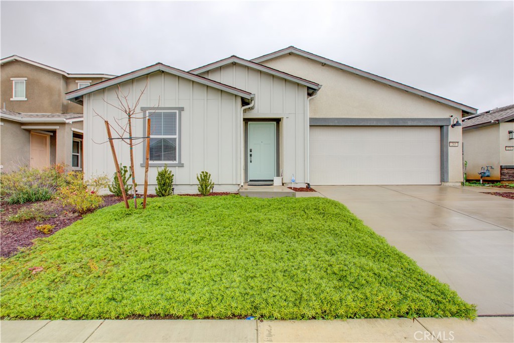 265 White Rim Court Merced, CA 95341 - Photo 1 of 1 a front view of a house with a yard and garage